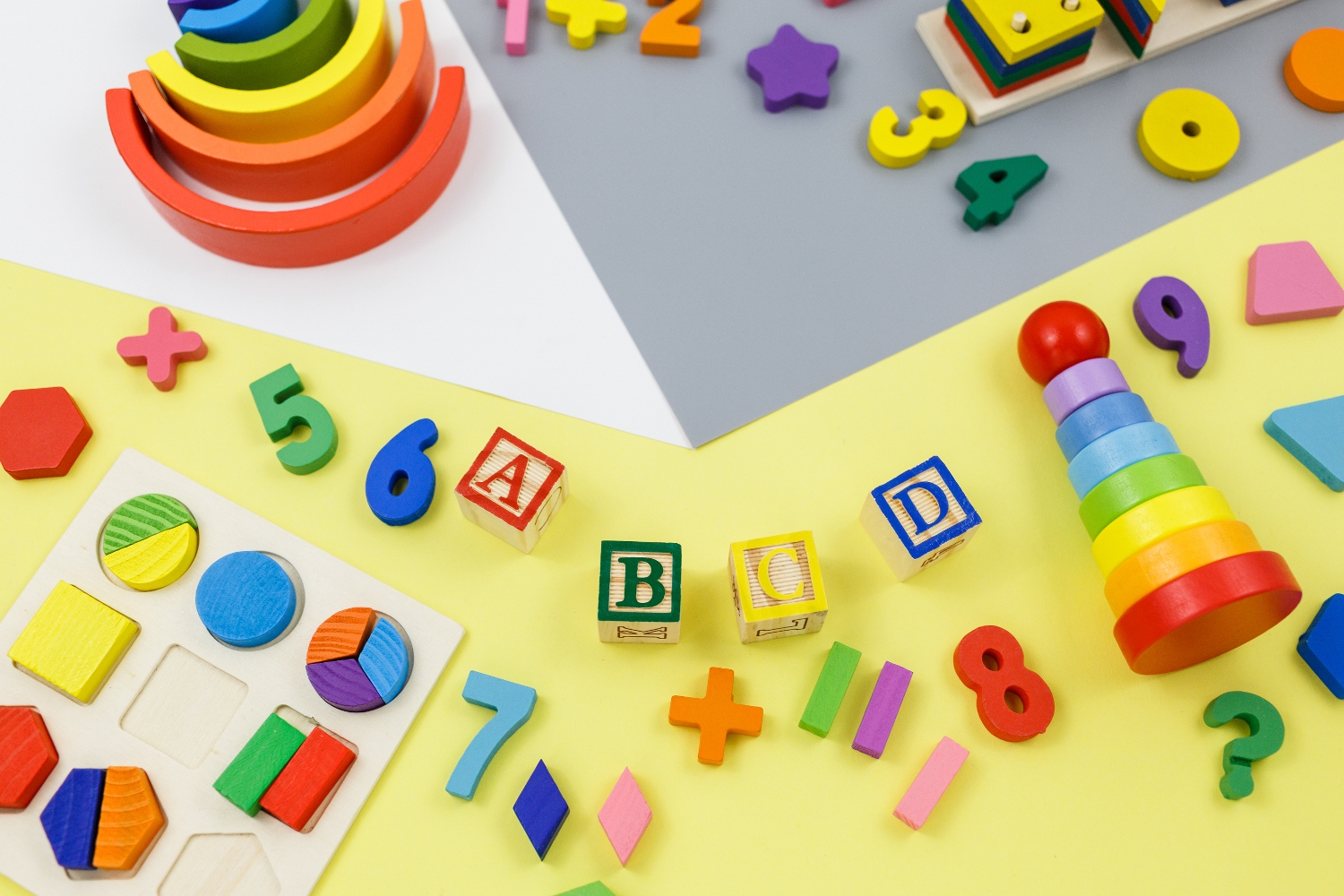 Wooden,Kids,Toys,On,Yellow,Gray,Paper.,Educational,Toys,,Blocks,