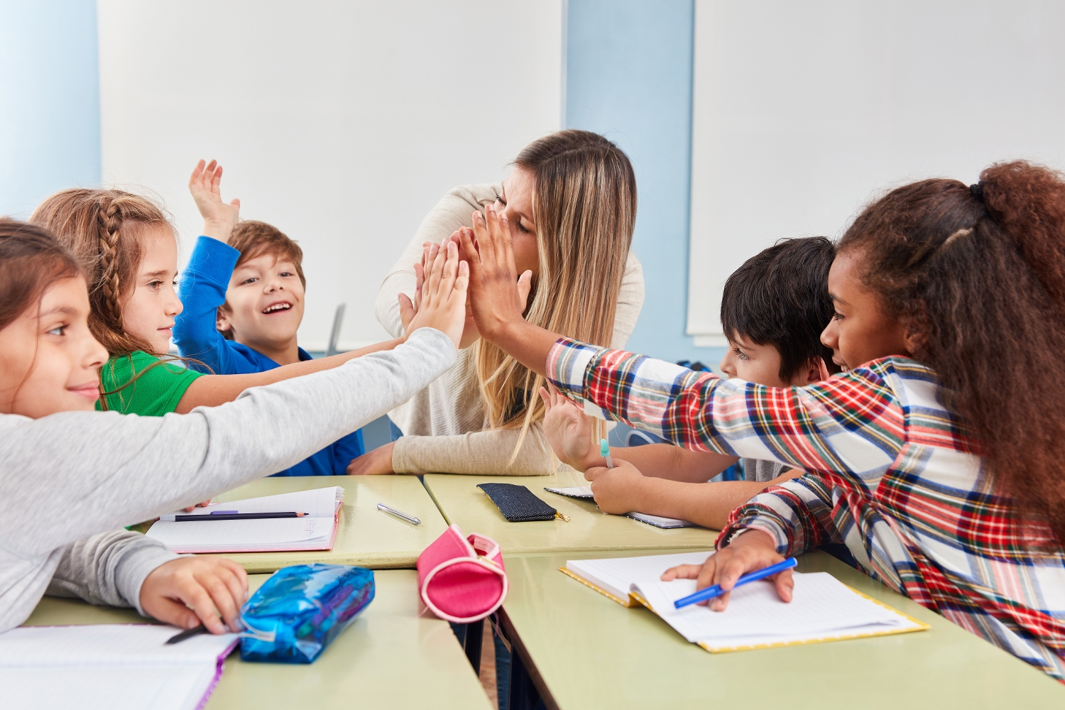 Group,Of,Students,Makes,High,Five,In,The,Classroom,Of