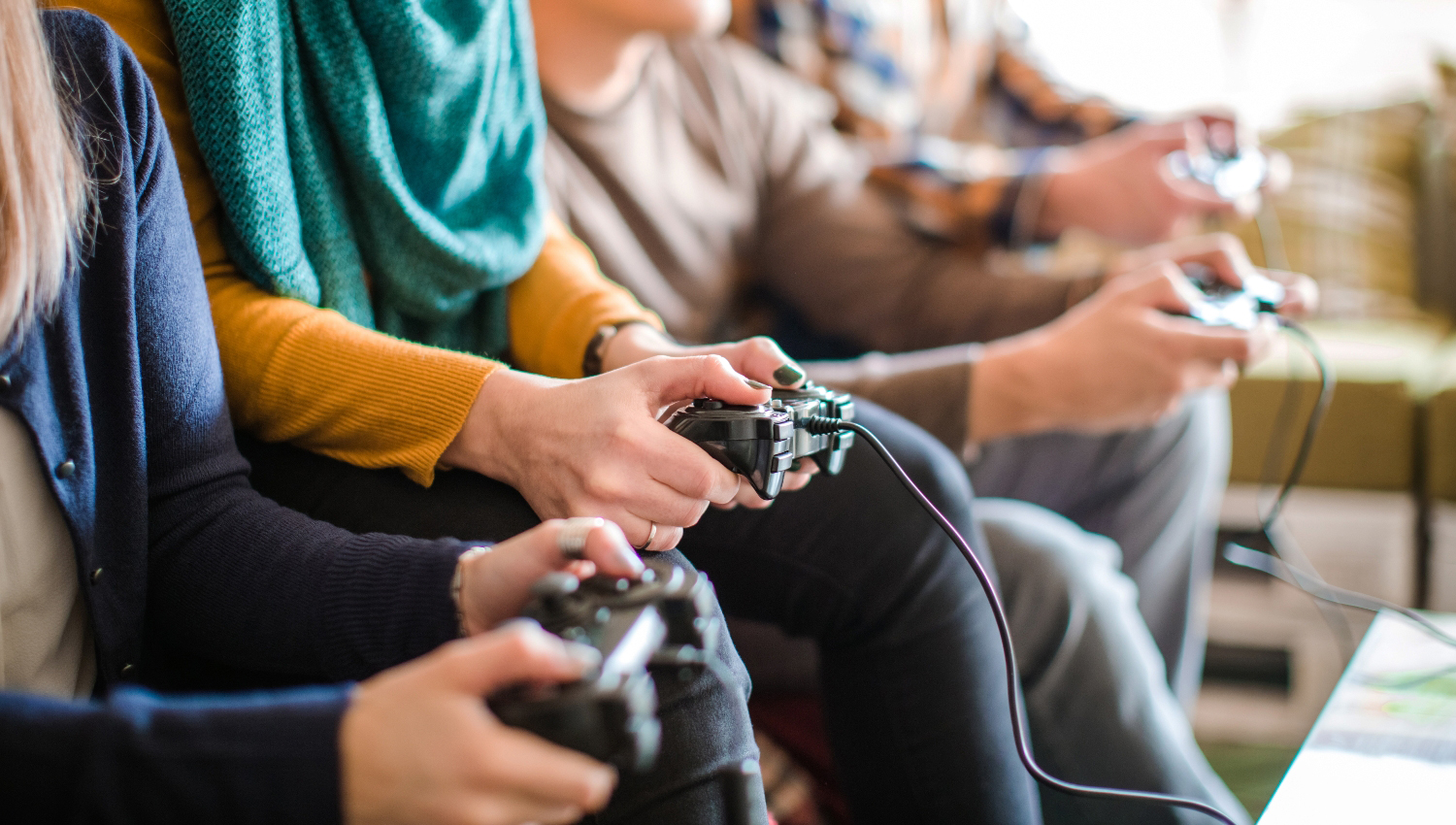 Group of friends playing digital games at home.